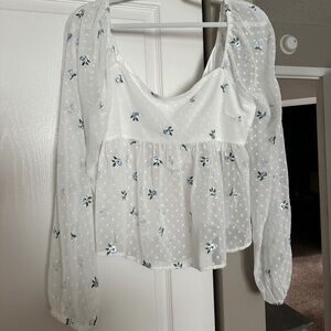 White shirt with blue floral details